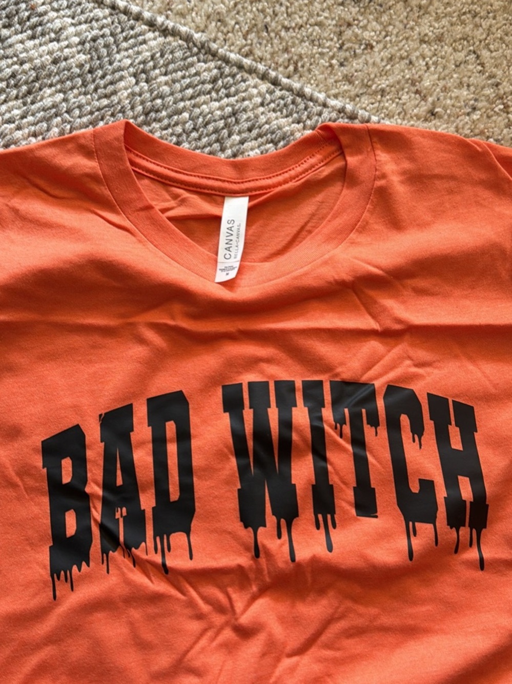 Bella Canvas Orange Short Sleeve Tee with Black 'Bad Witch' Graphic